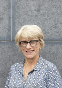 Headshot of woman smiling to camera.